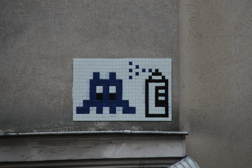 space invaders and spray can mosaic graffiti in paris